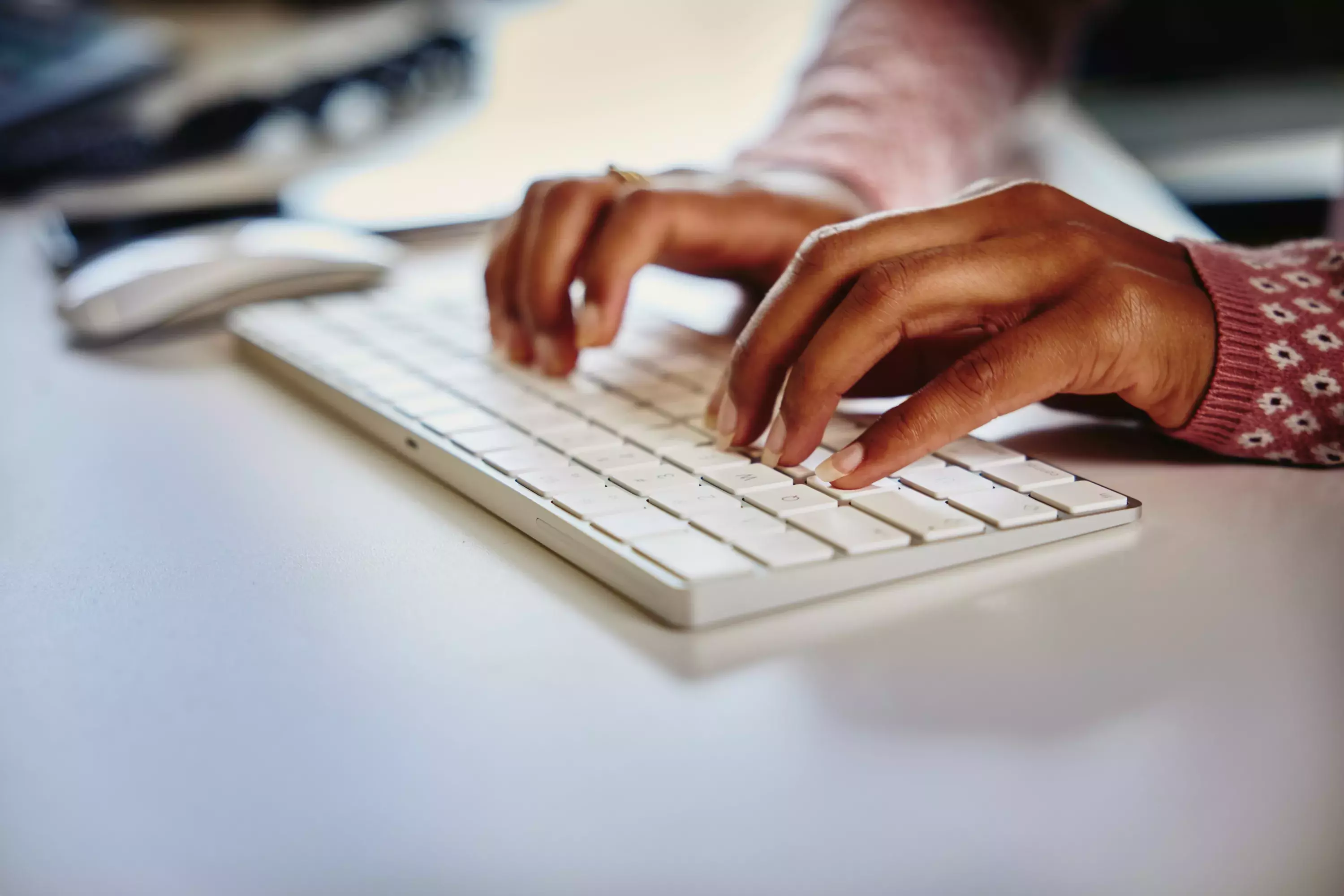 Close up typing on a keyboard of a computer