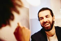 Close up - Smiling man looking at someone.