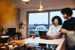 Woman sitting at a desk working on marketing platform.