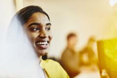 Smiling woman working behind her desk